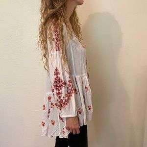 Free People white top with colorful floral design